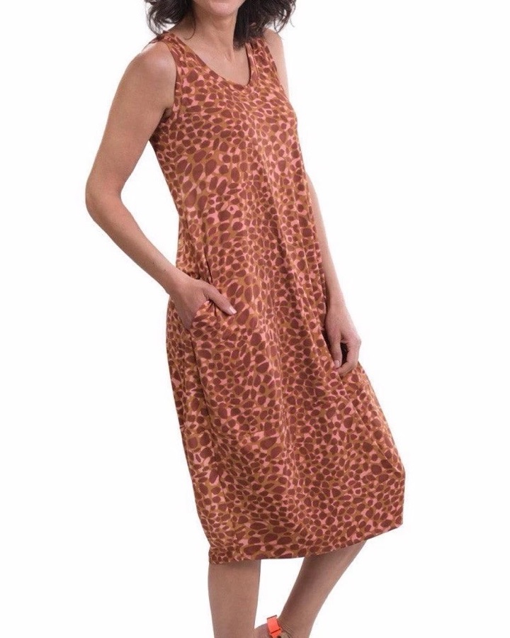 A rust printed cocoon dress, sleeveless, worn with sandals