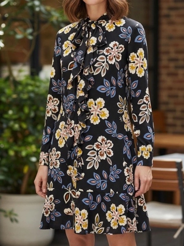 A black floral silk shirt dress with a tie neck